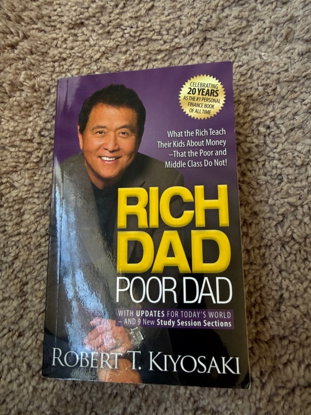 Rich Dad Poor Dad by Robert T. Kiyosaki - Yellow & Purple Cover